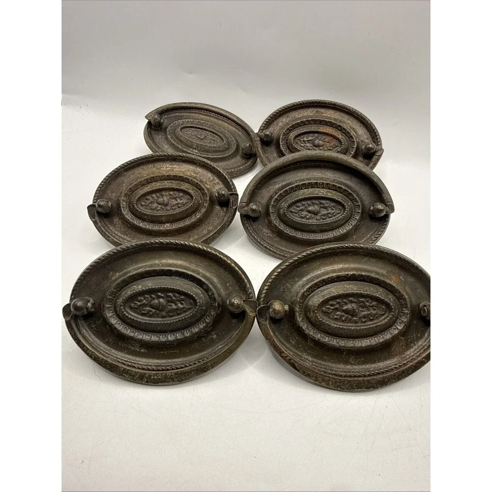 Antique Hepplewhite-style drawer pulls embossed oval backplate